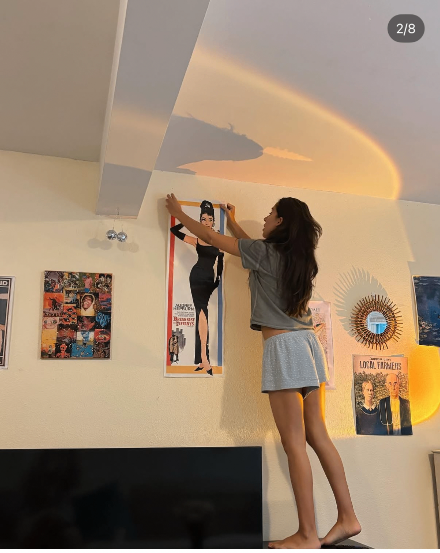 Hanging a poster in the chapter room