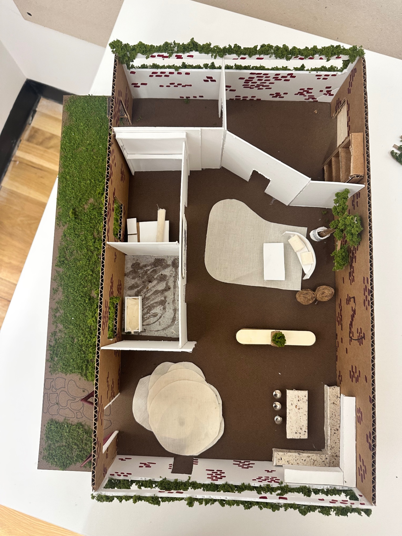 Overhead view of a cardboard architectural model of Noguchi's studio.