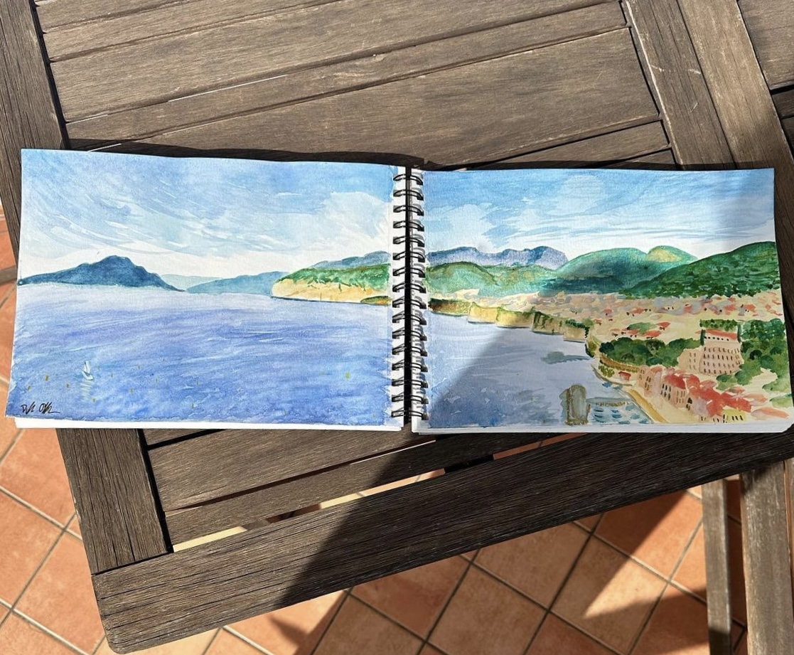 Watercolor sketchbook spread of the Sorrento coastline.